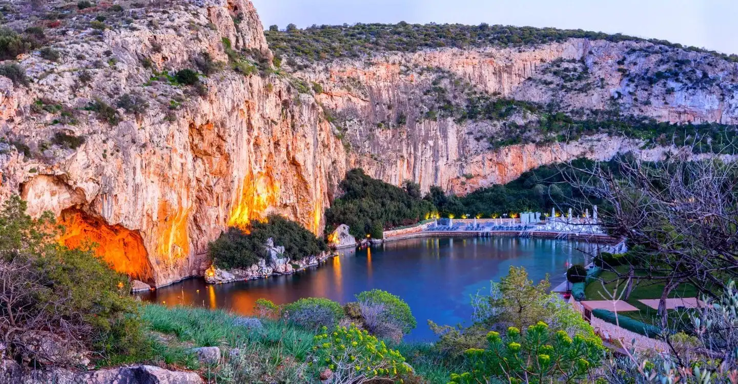Crystal turquoise thermal lagoon waters at Lake Vouliagmeni, Athens Riviera